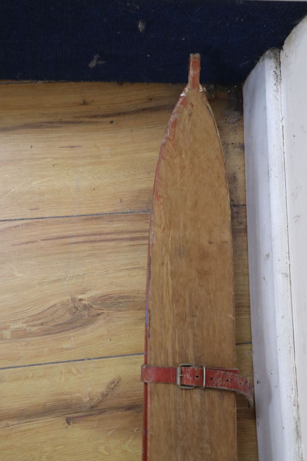 A set of wooden skis and poles